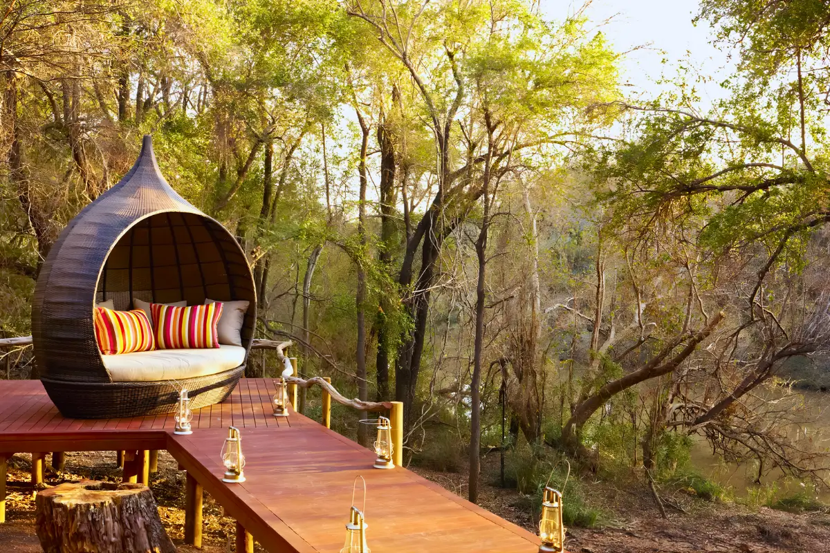 Outdoor daybed at Jaci Safari Lodge overlooking the bush in South Africa.