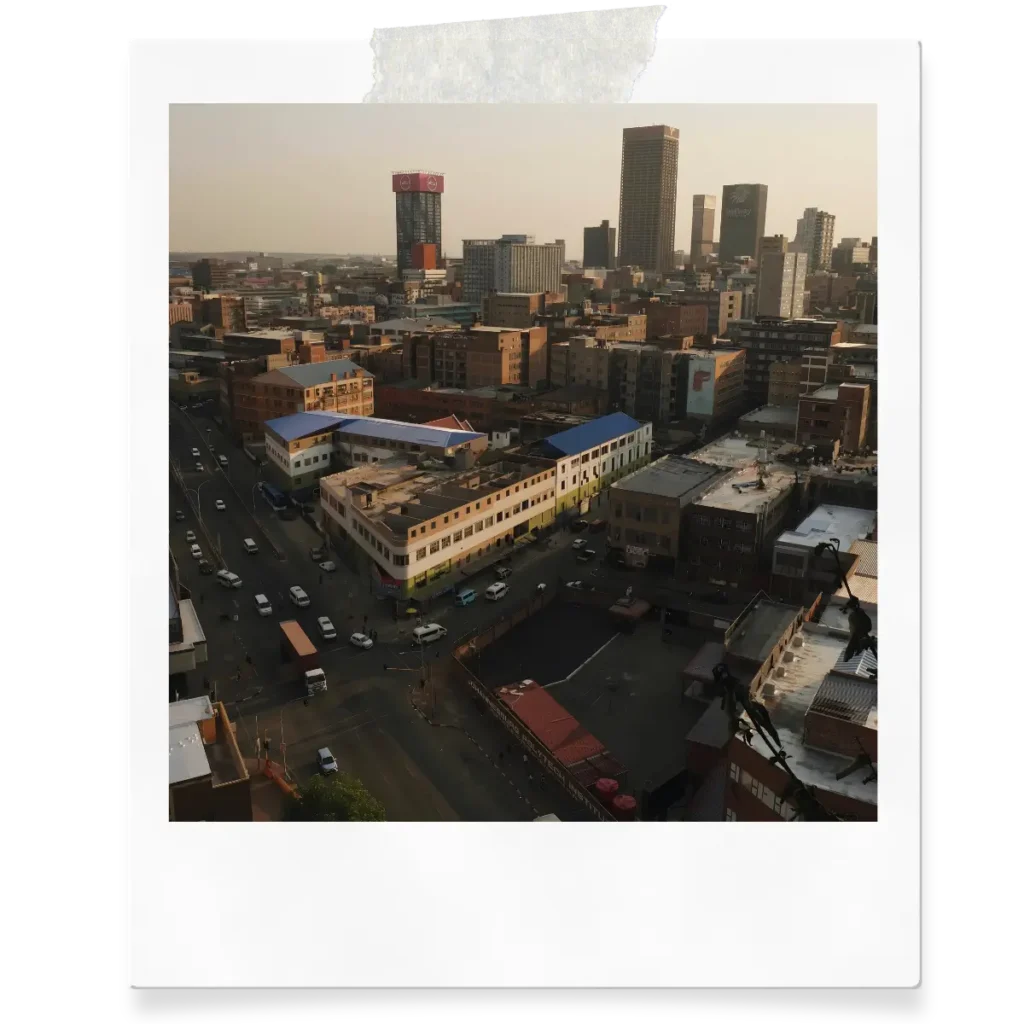 Aerial view of Johannesburg city buildings in the afternoon light.