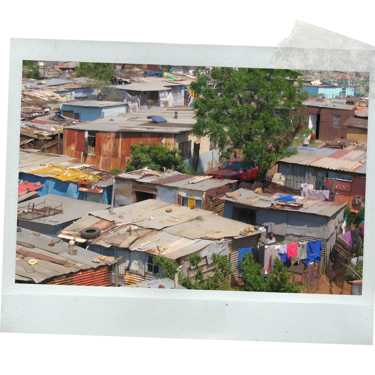 Polaroid-style photo of rooftops and informal homes in Soweto.