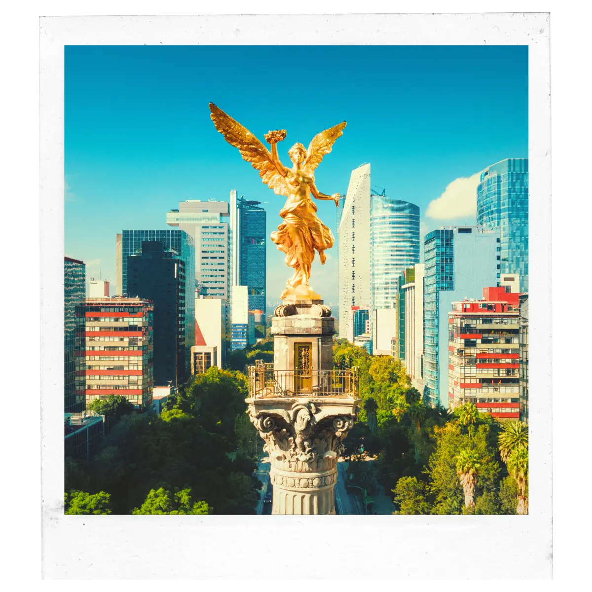 Golden Angel of Independence statue rising above Paseo de la Reforma in Mexico City.
