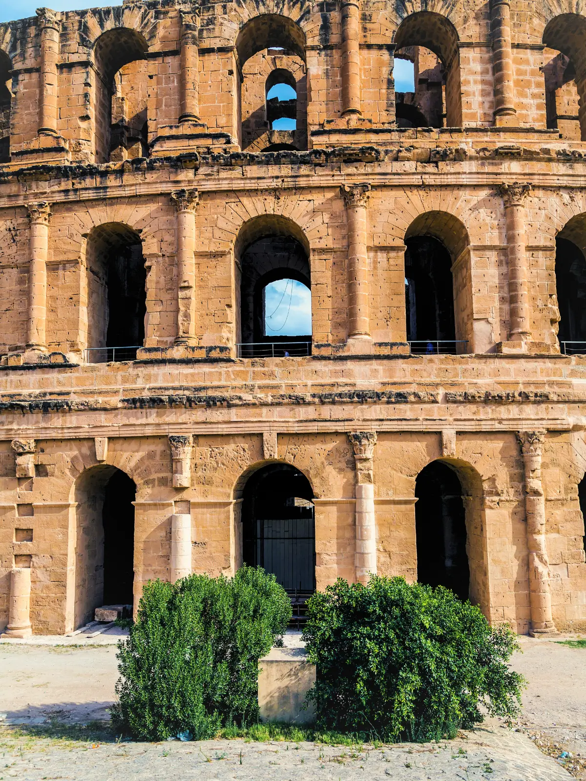 Stone arches of the El Djem Amphitheatre in Tunisia.