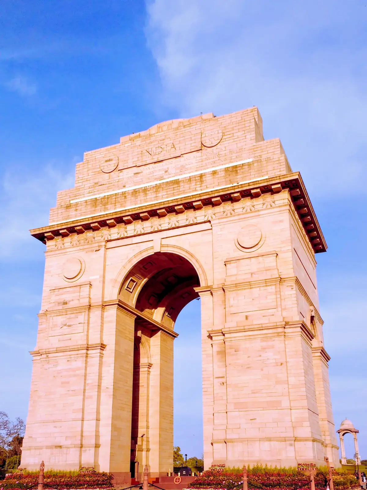 India Gate monument in New Delhi in warm daylight.