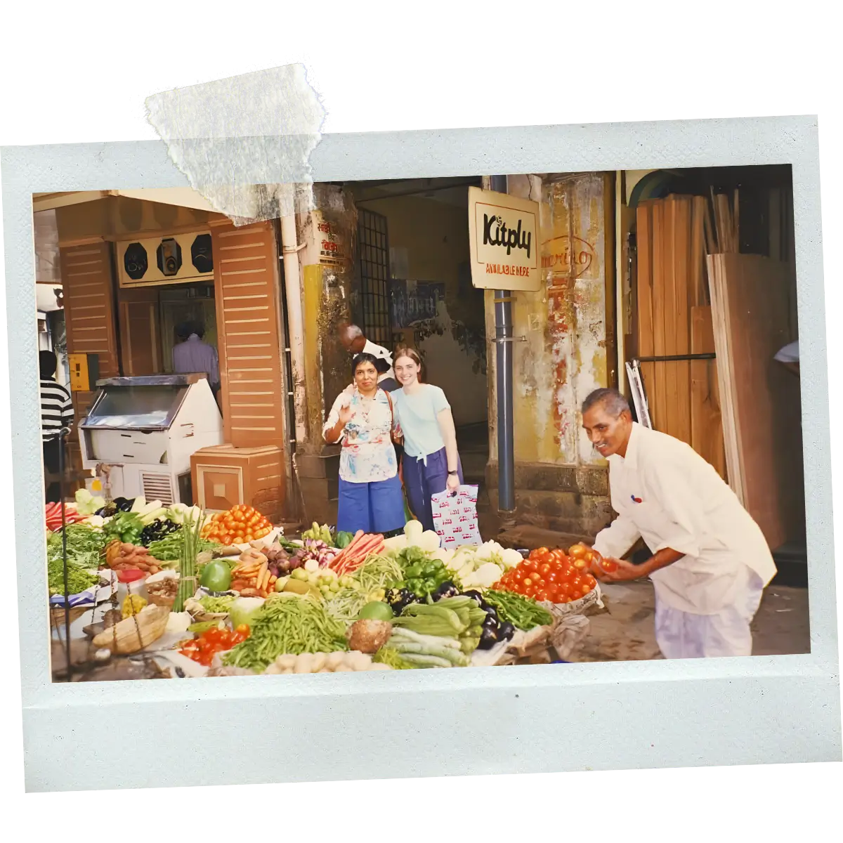 Alt Text Manu visiting a local vegetable market in India.