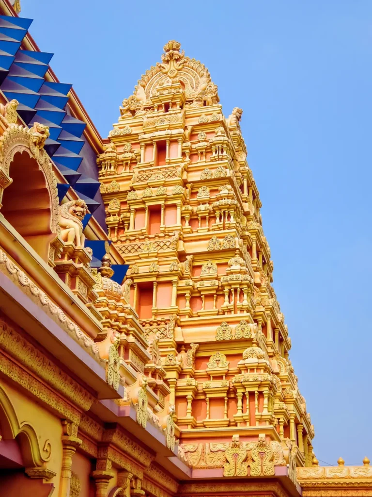 Decorated Hindu temple gopuram rising above the complex in India.
