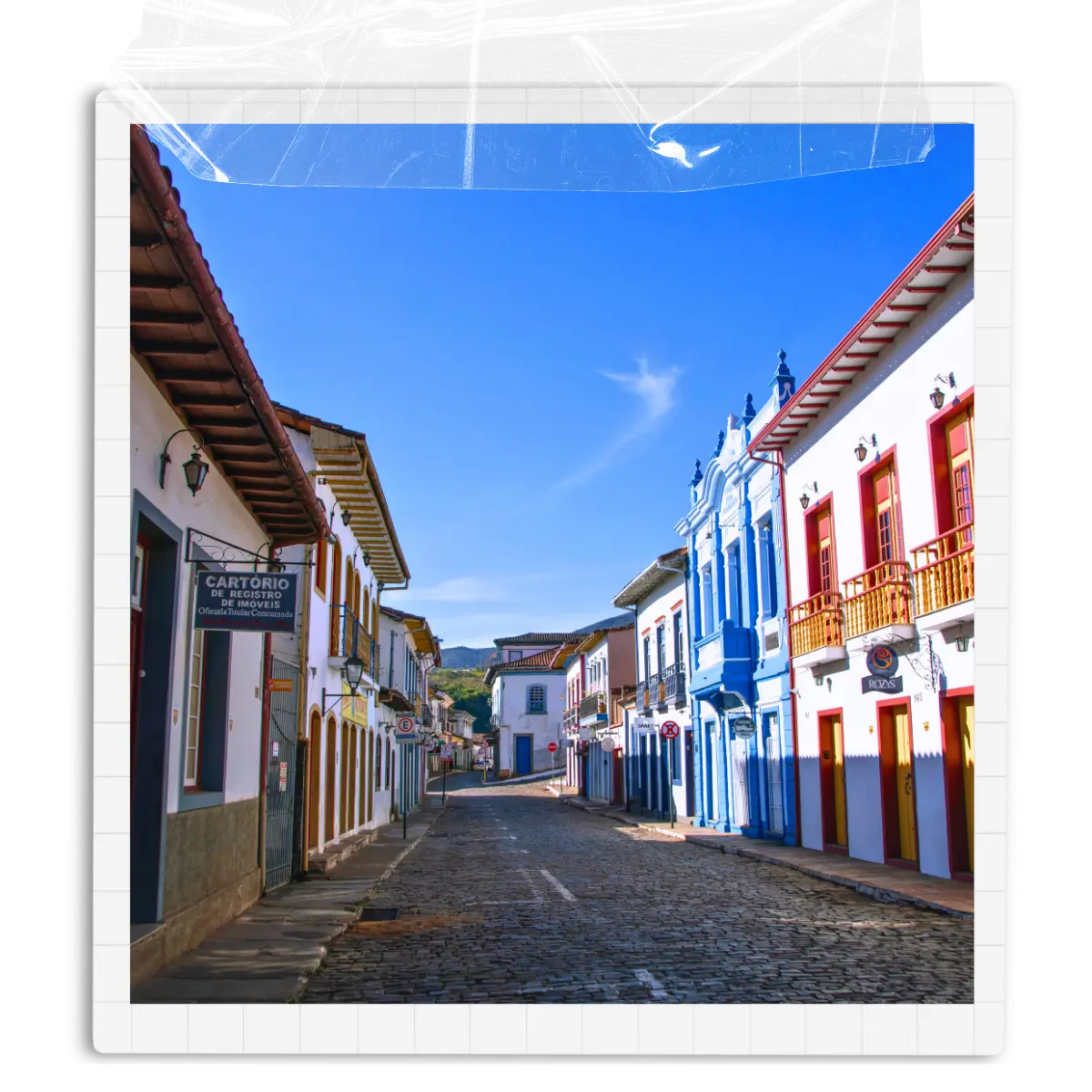 Colourful colonial buildings lining a cobbled street in Minas Gerais, Brazil.
