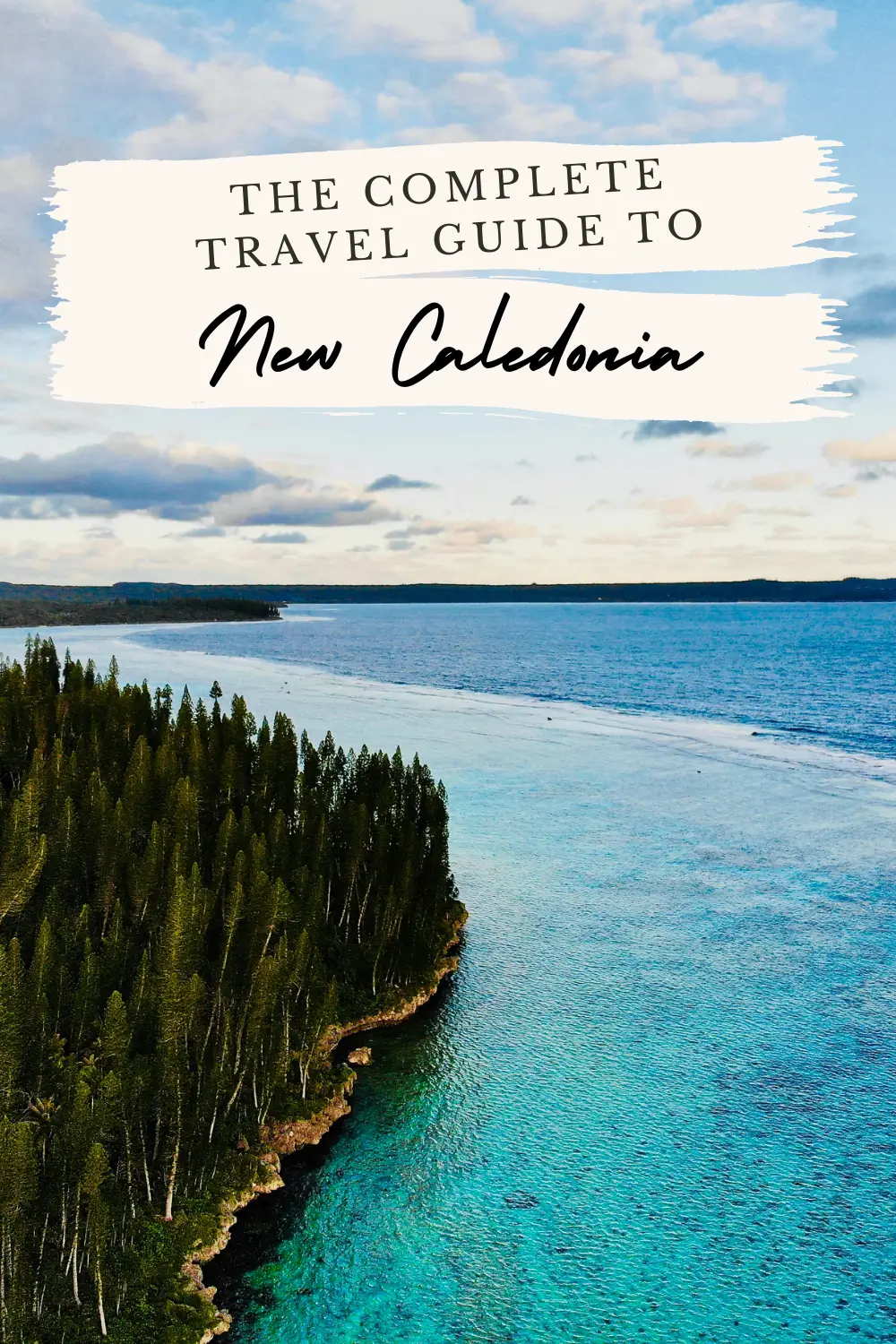 New Caledonia lagoon coastline with travel guide title overlay.