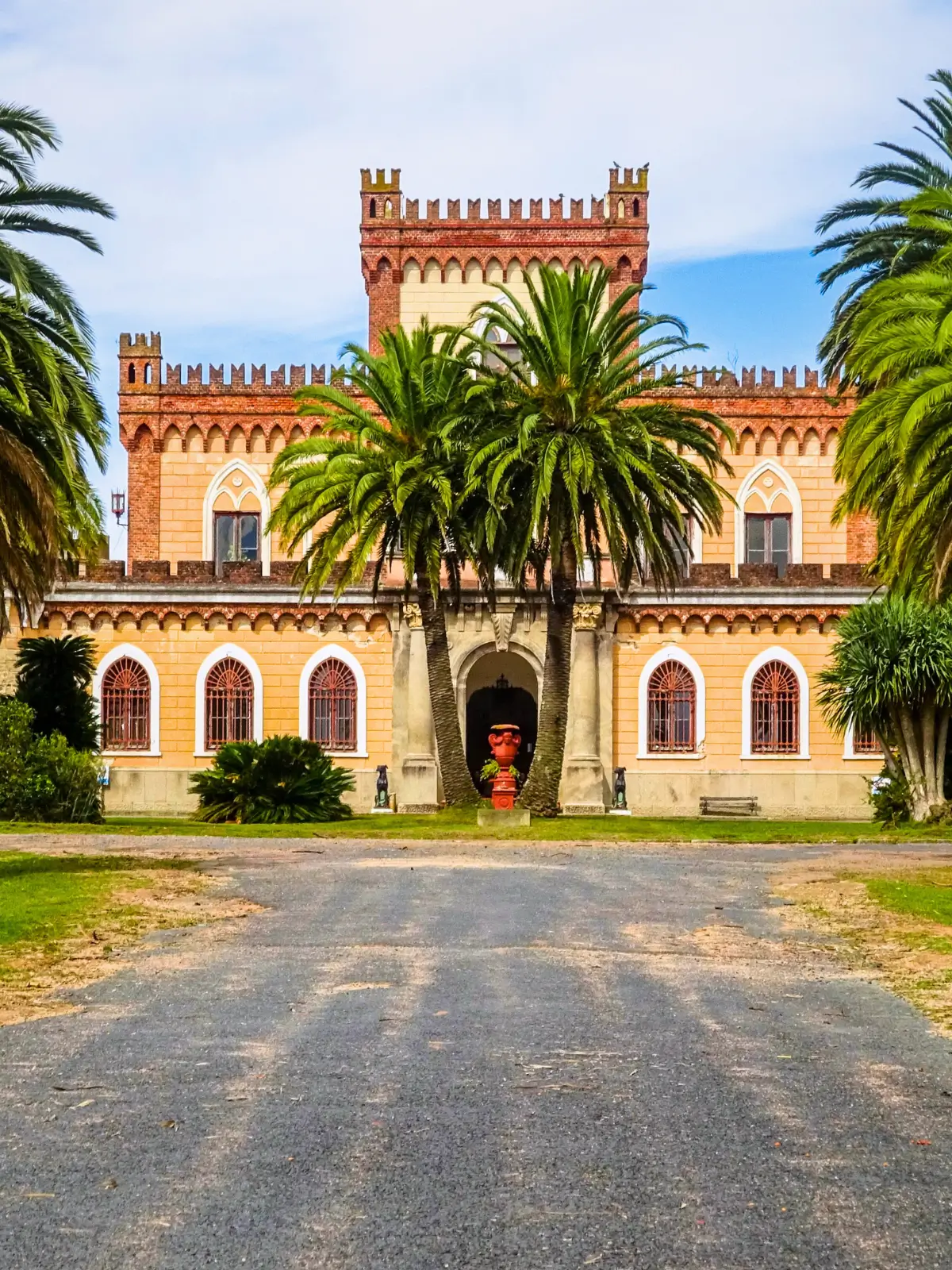 Castillo Pittamiglio historic castle style building surrounded by palm trees in Montevideo.
