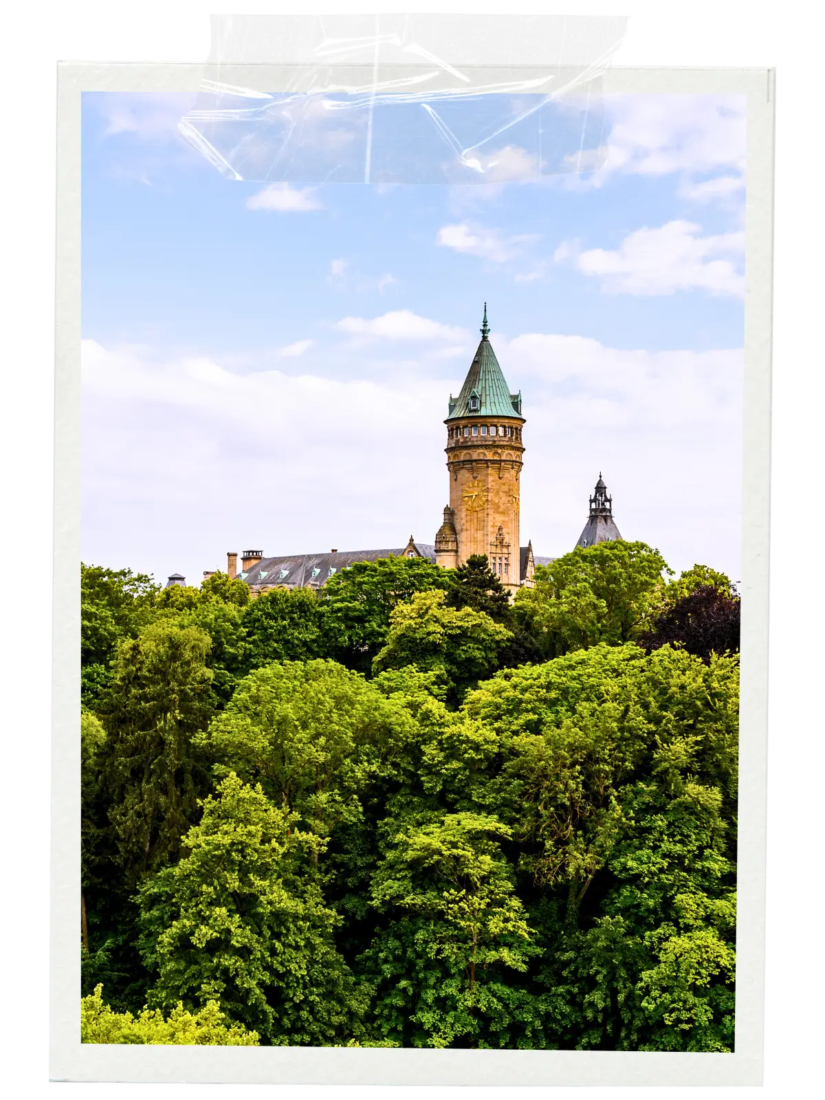 Church and river in a valley with cliffs and old town.