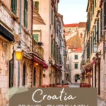 Narrow stone street with historic buildings in Dubrovnik Old Town Croatia.