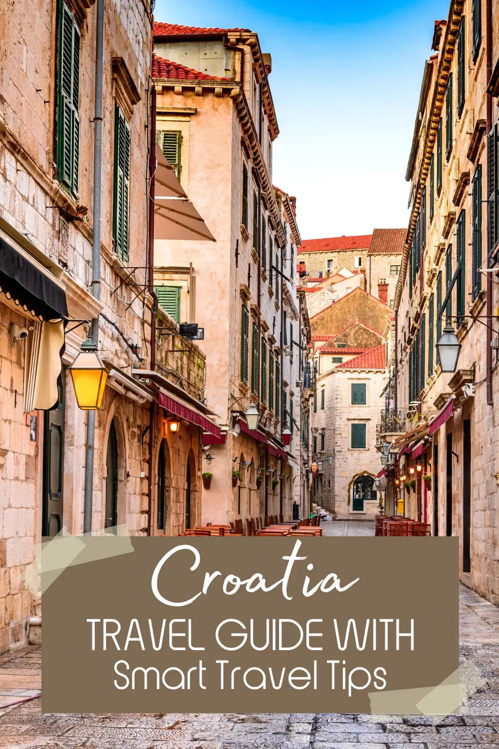 Narrow stone street with historic buildings in Dubrovnik Old Town Croatia.