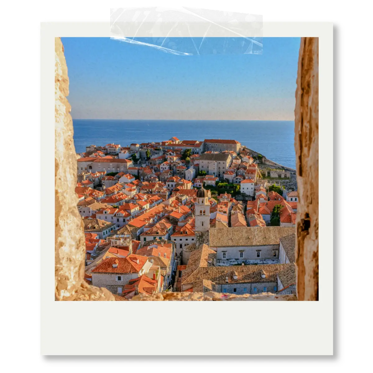 View of Dubrovnik Old Town red rooftops and Adriatic Sea seen from the city walls in Croatia.