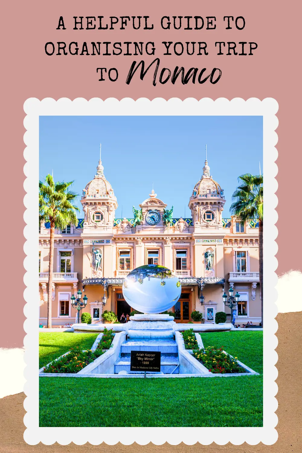 Monte Carlo Casino in Monaco with Sky Mirror sculpture in front and palm trees under a clear blue sky.