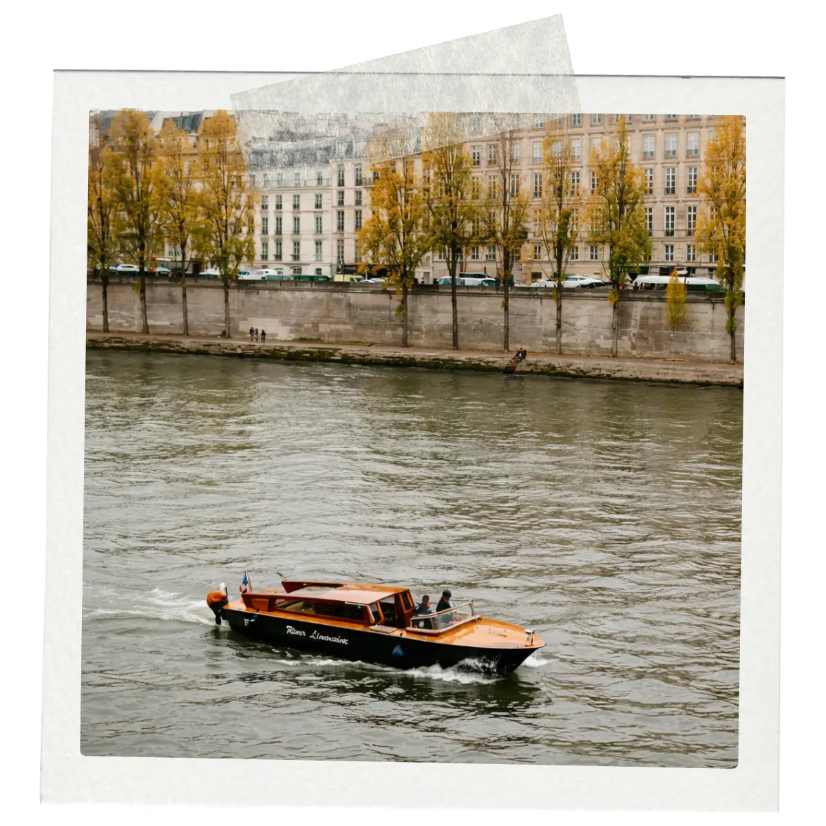 Wooden boat cruising along the Seine River in Paris.