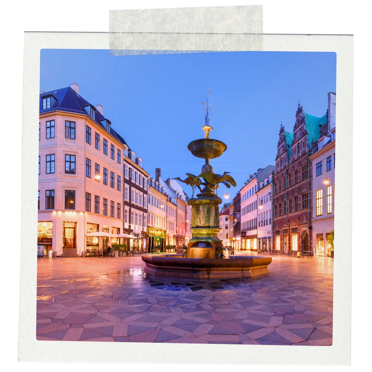 Stork Fountain in Amagertorv Square surrounded by historic buildings in central Copenhagen.