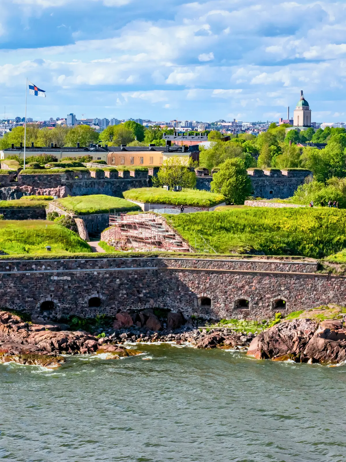 Stone walls of Suomenlinna sea fortress along the coast in Helsinki Finland.