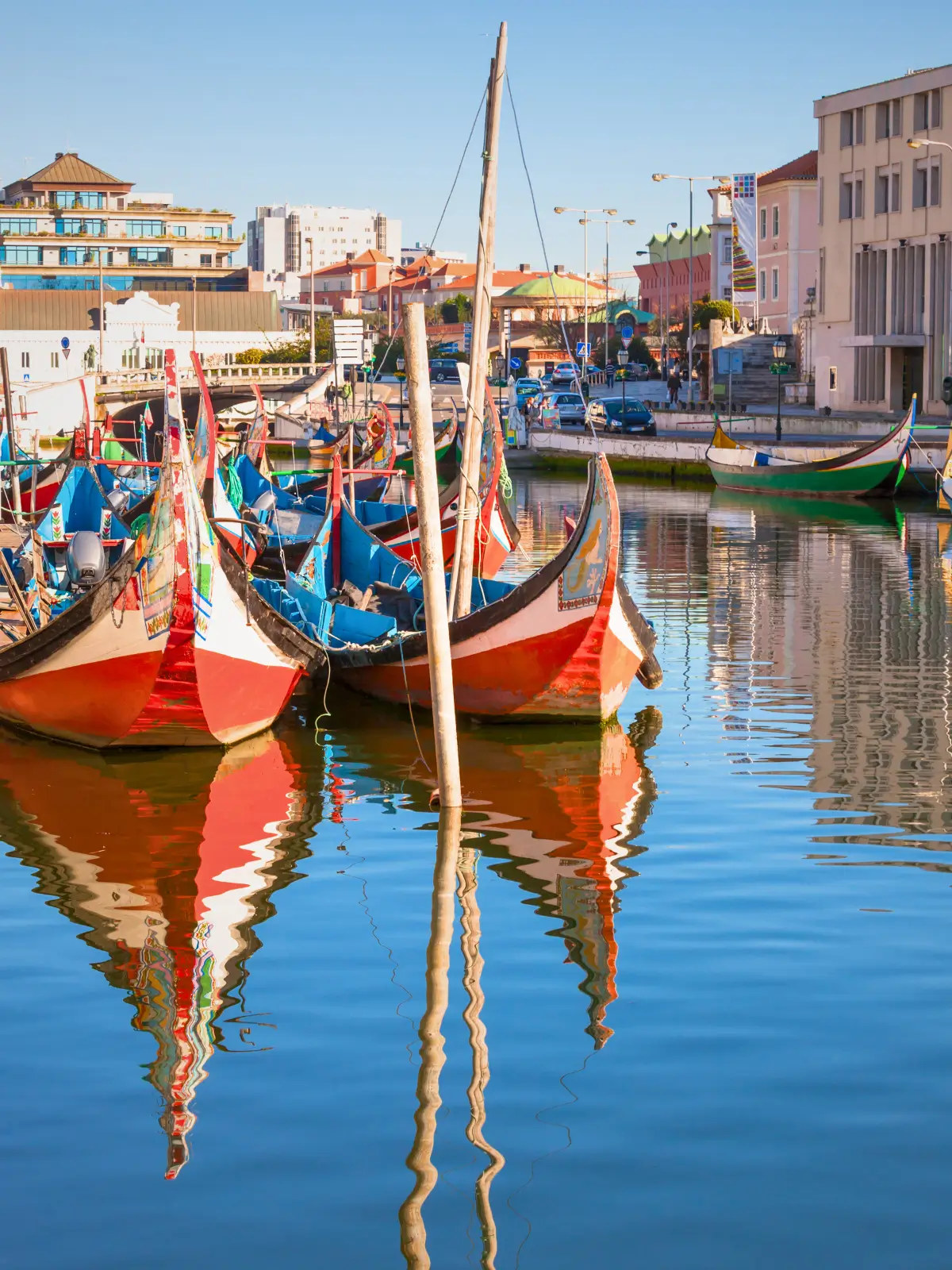Traditional moliceiro boats lined along the canal in Aveiro.