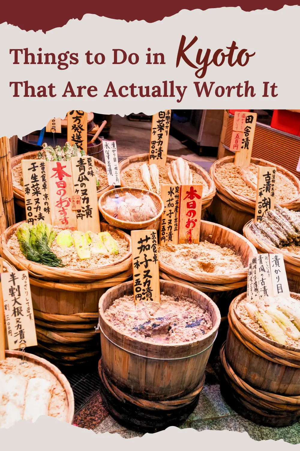 Traditional pickles displayed in wooden tubs at Nishiki Market in Kyoto.