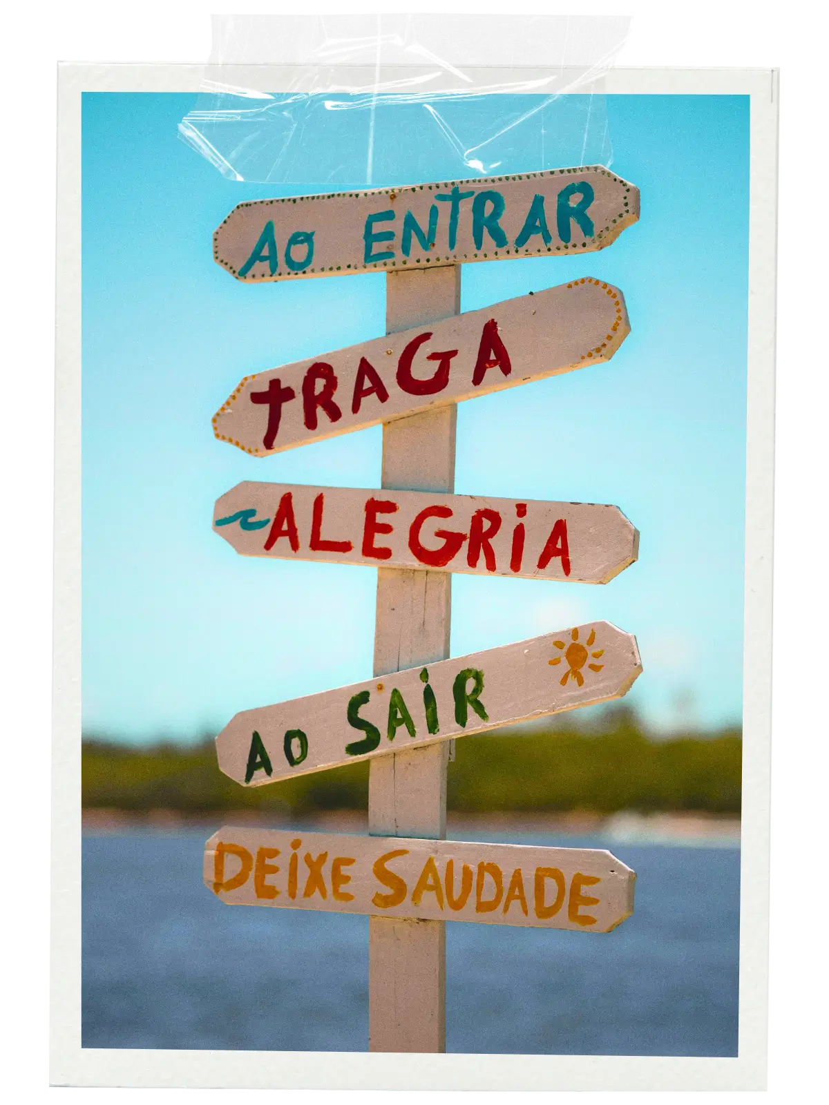 Colourful wooden signpost in different directions.