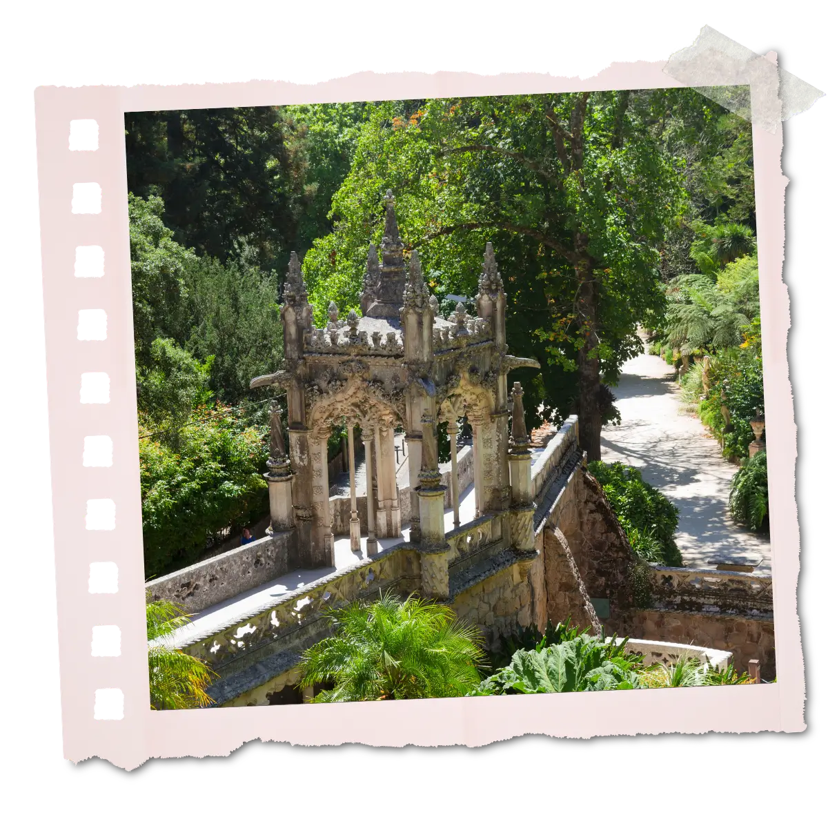 Ornate stone structure and staircase at Quinta da Regaleira surrounded by greenery in Sintra, Portugal.
