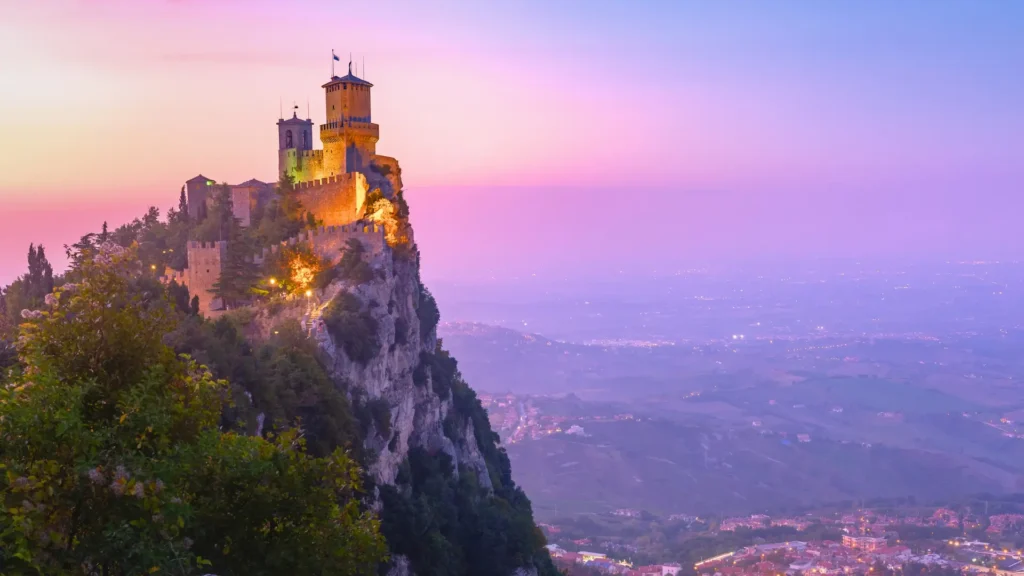 Guaita Tower on Mount Titano in San Marino at sunset overlooking the valley.