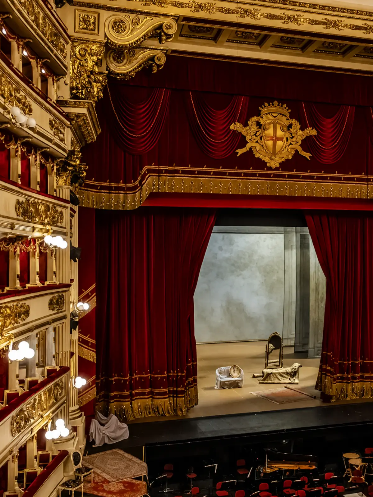 Interior stage and red velvet curtains at La Scala Theatre.