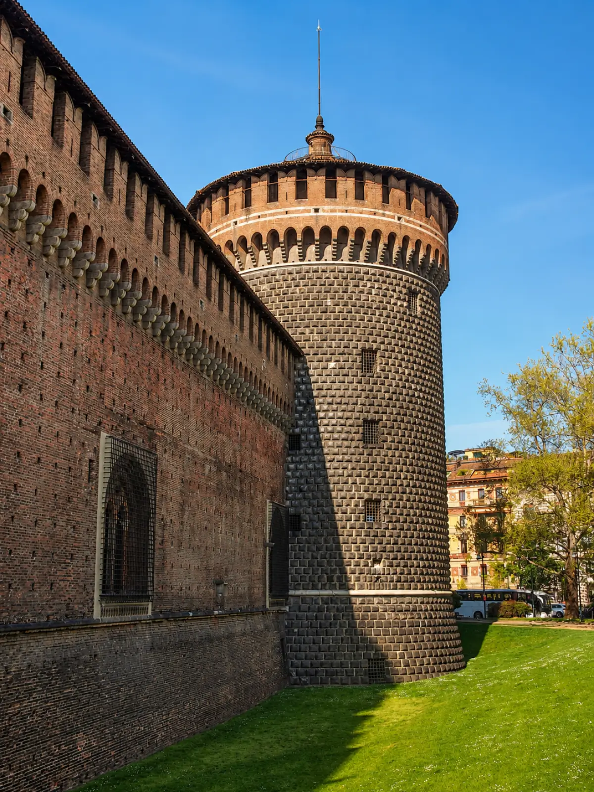 Round tower and brick walls of Sforza Castle.