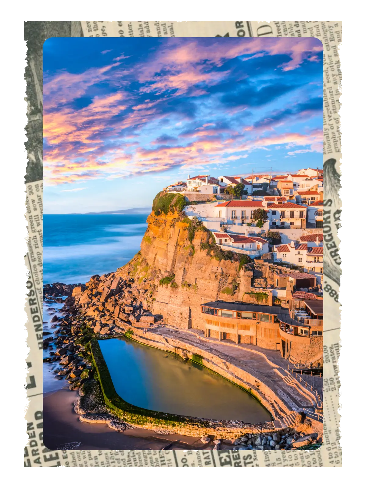 Clifftop view of Azenhas do Mar village in Portugal at sunset.