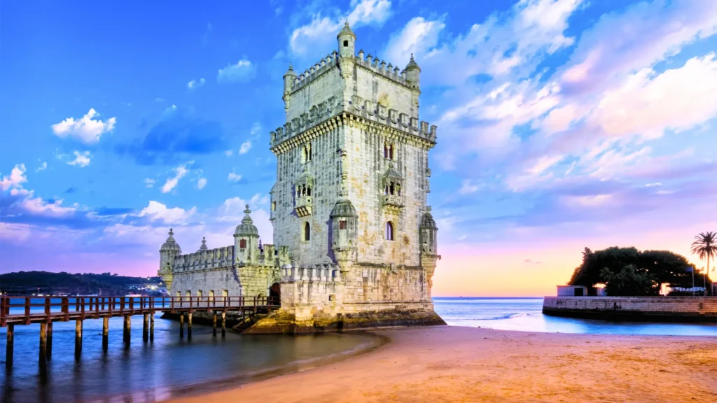 Belém Tower in Lisbon, Portugal, by the Tagus River at sunset.