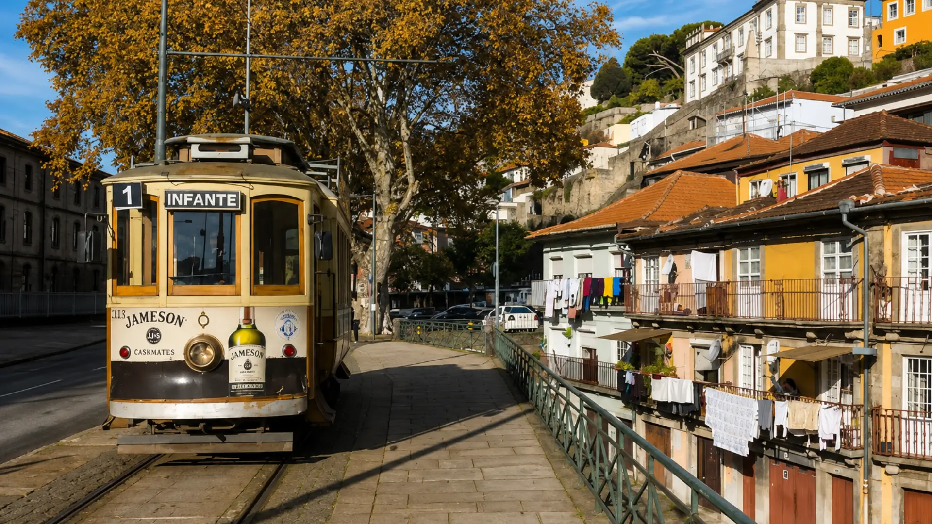 Vintage tram passing traditional houses along a hillside street in Boavista, Porto.