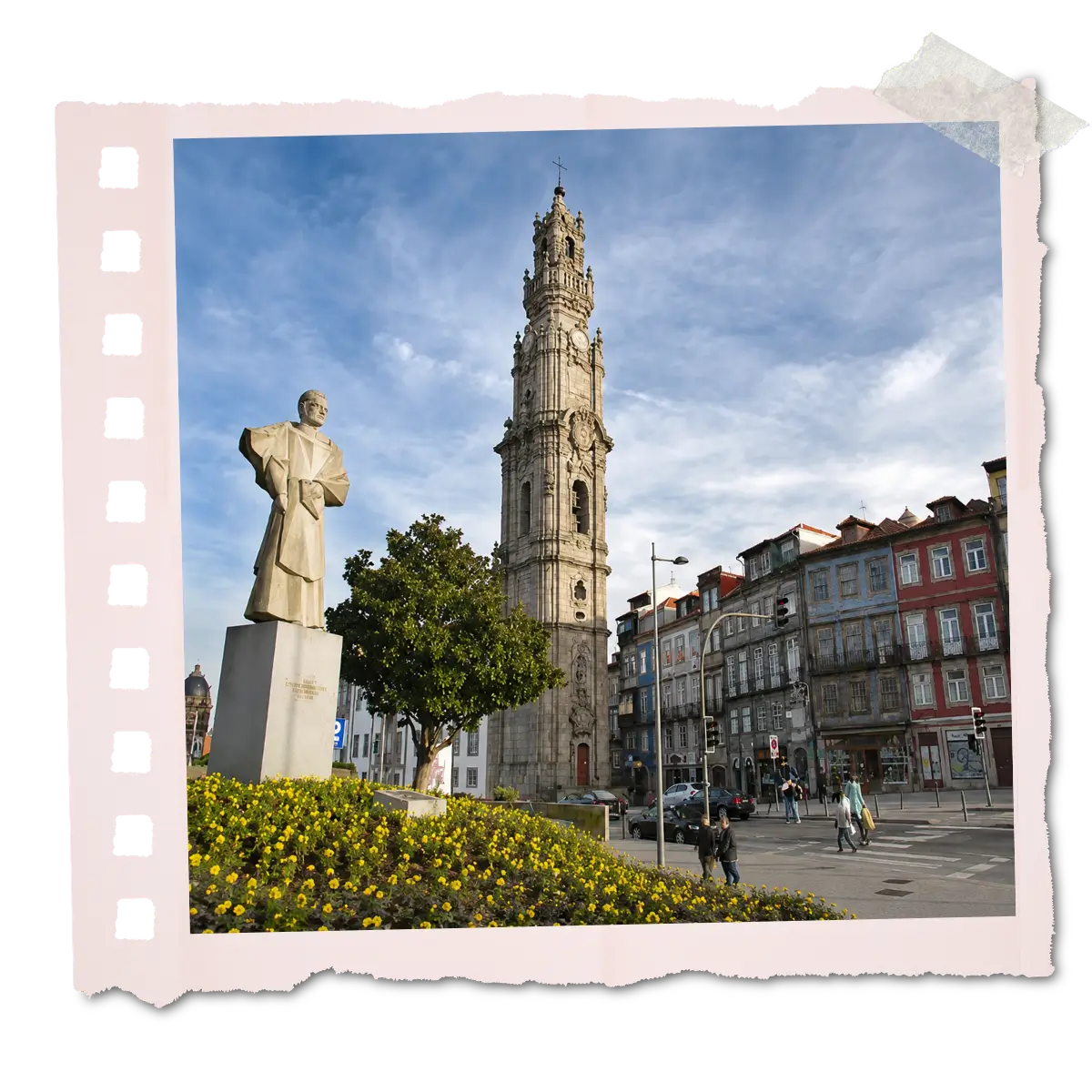 Clérigos Tower with a statue and colourful buildings in Porto.