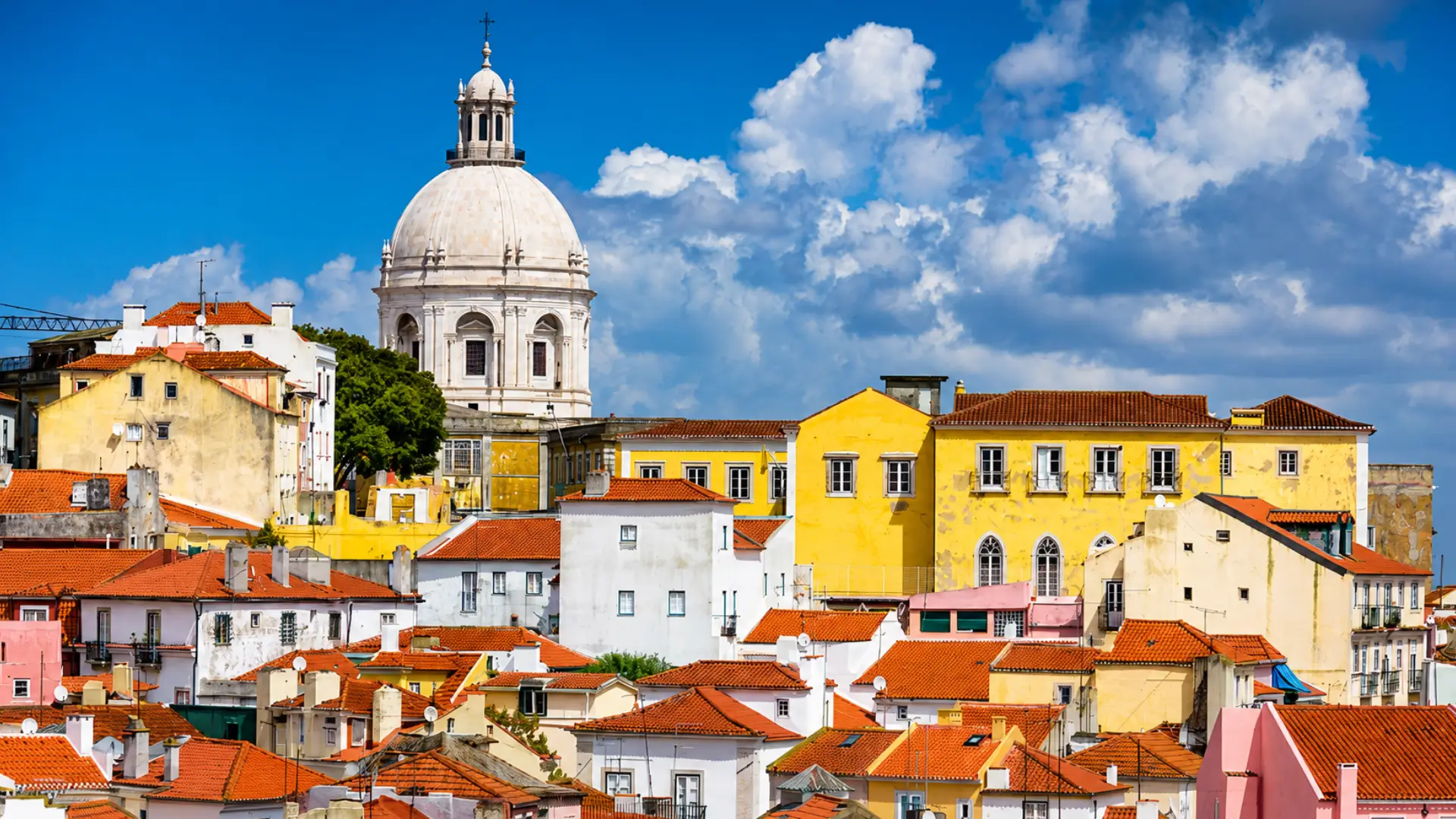 Lisbon rooftops with the National Pantheon in the background.