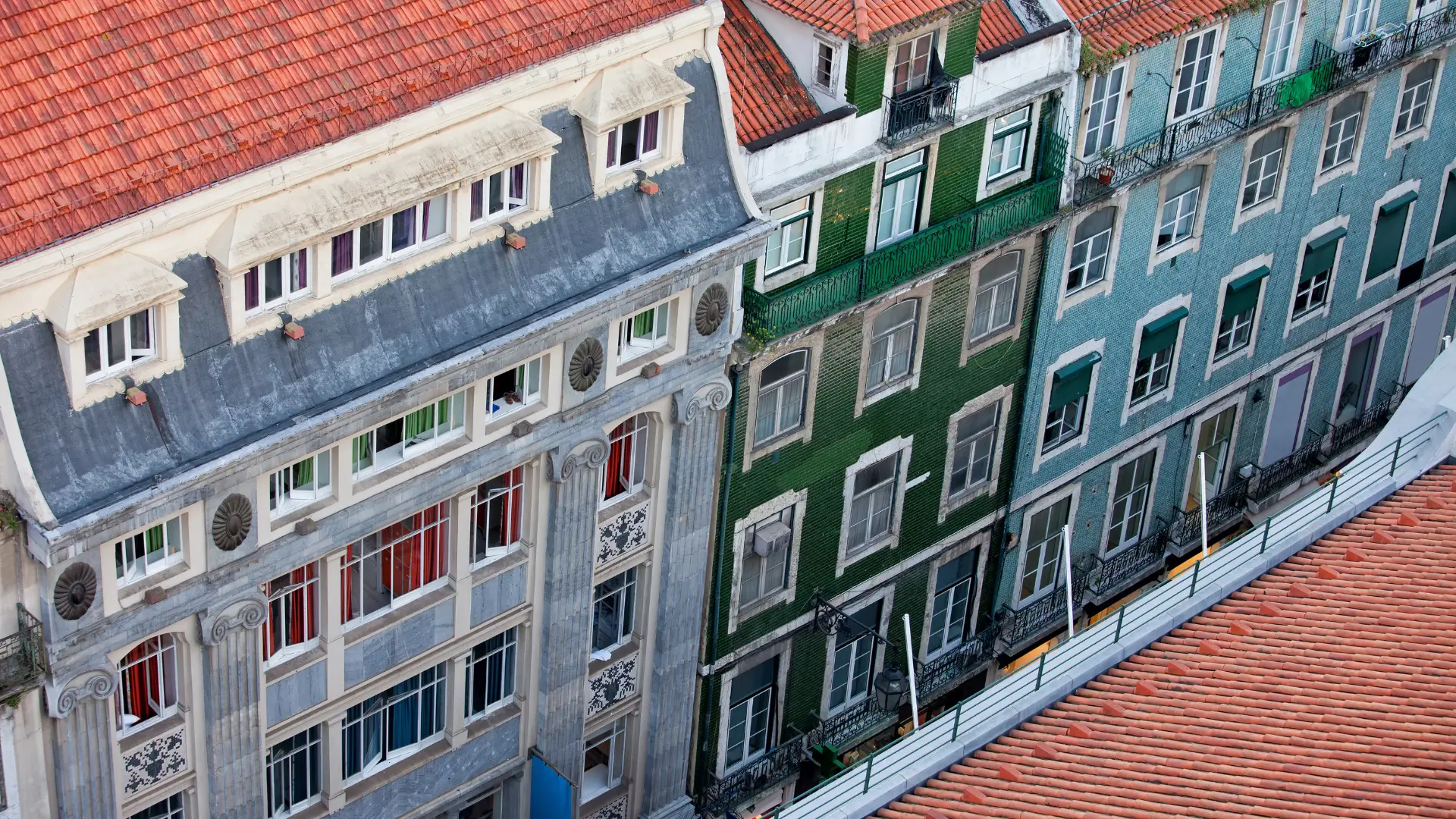 High-angle view of colorful historic building facades with tiled walls.