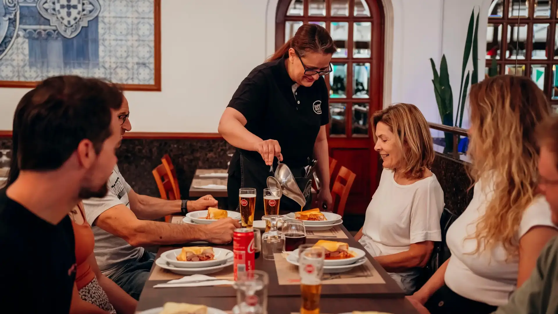 Travellers enjoying a guided food and wine experience in Porto.