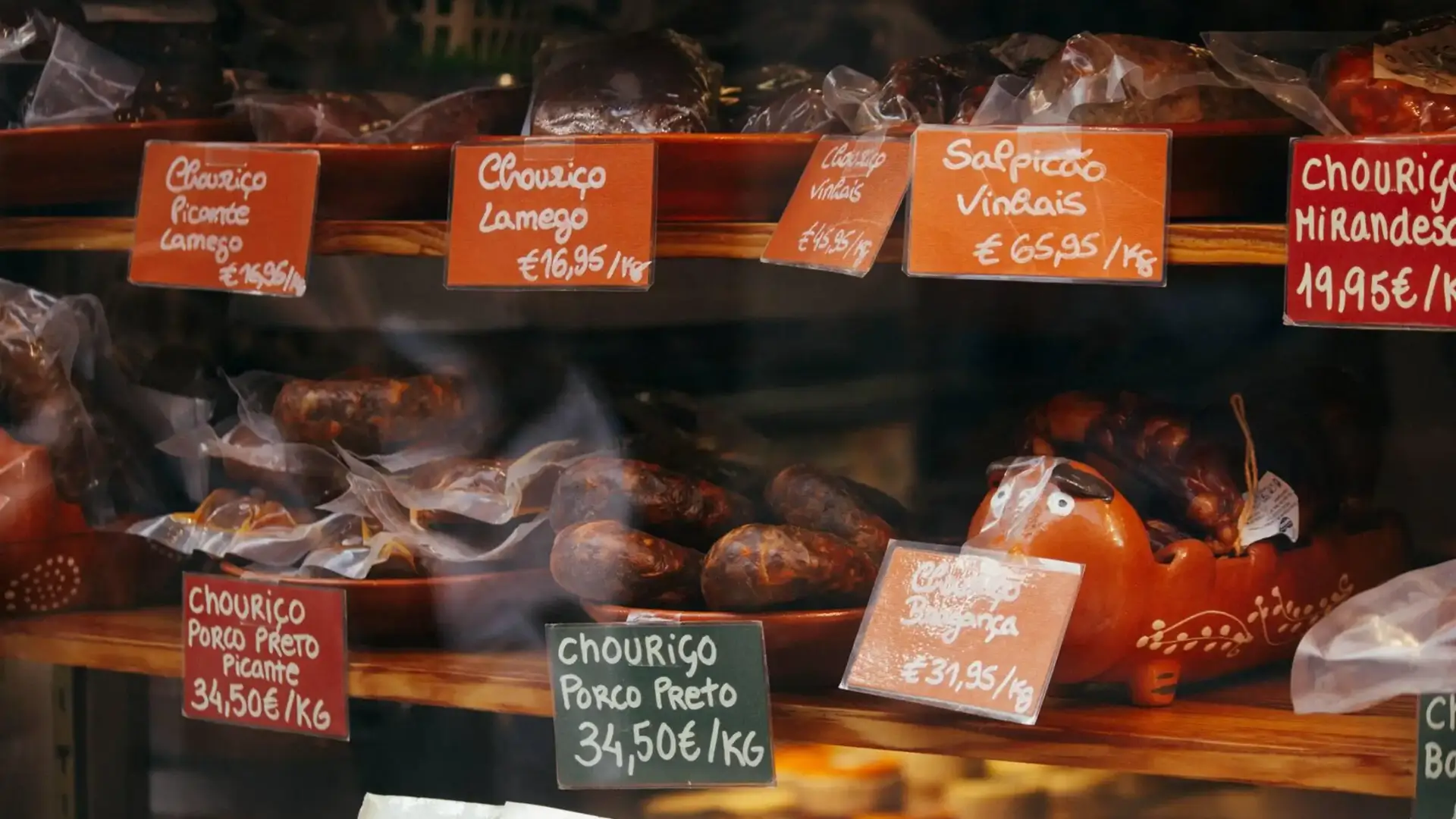 Traditional Portuguese chouriço and cured meats displayed at a local shop.
