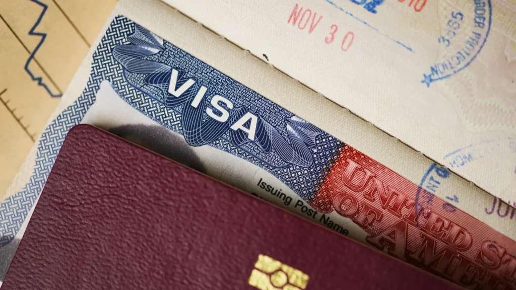 Passport showing a travel visa with international entry stamps.