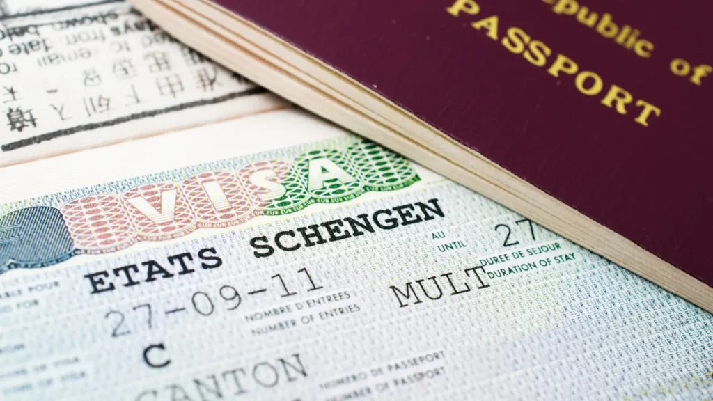 Schengen visa inside a passport.