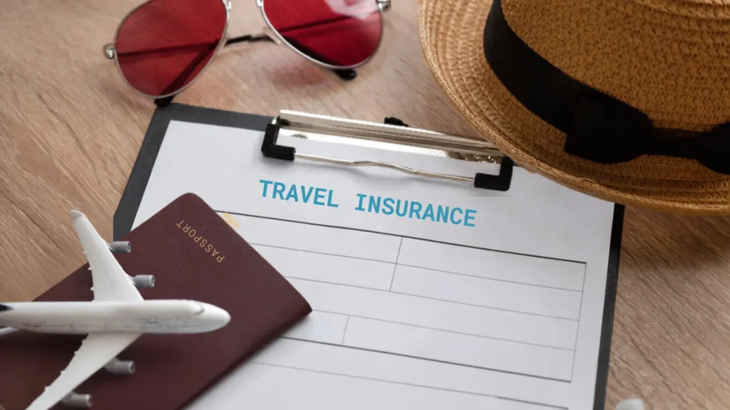 Travel insurance form with passport and model plane.